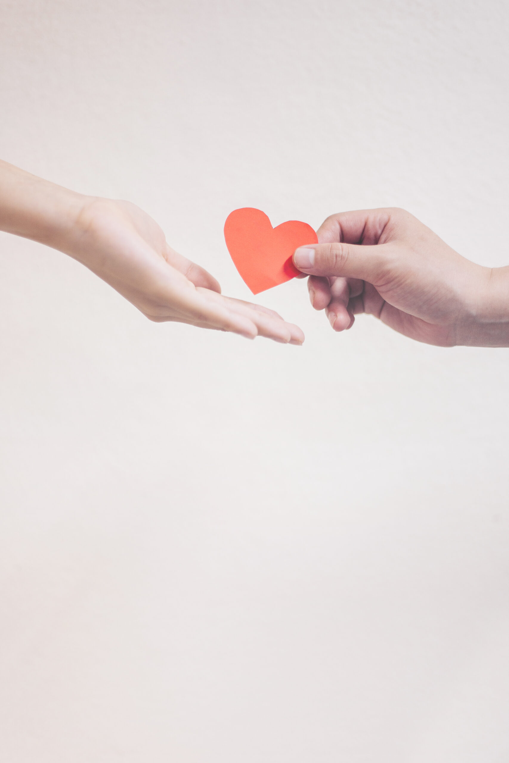 Soft Focus Hand Giving A Red Heart